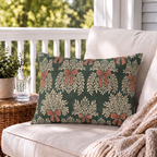 Forest green outdoor lumbar pillow with cream garland sprays and clay bows, second view