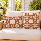 Moroccan Zellige Star Terracotta outdoor pillow and outdoor lumbar pillow styled together as a set on a porch loveseat