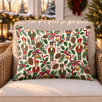Ivory nutcracker and holly outdoor lumbar pillow on a rattan chair on a Christmas porch