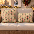 Tan lattice nutcracker outdoor pillow and outdoor lumbar pillow styled together as a set on a wicker loveseat for Christmas
