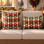 Red plaid nutcracker outdoor pillow and outdoor lumbar pillow styled together as a set on a wicker loveseat for Christmas