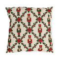 Christmas nutcracker outdoor pillow with a holly trellis, poinsettias and red and green nutcracker soldiers on cream