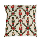 Christmas nutcracker outdoor pillow with a holly trellis, poinsettias and red and green nutcracker soldiers on cream