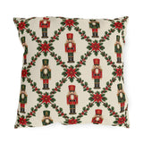 Christmas nutcracker outdoor pillow with a holly trellis, poinsettias and red and green nutcracker soldiers on cream