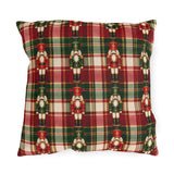 Christmas nutcracker outdoor pillow with small nutcracker soldiers on red, green and cream tartan plaid