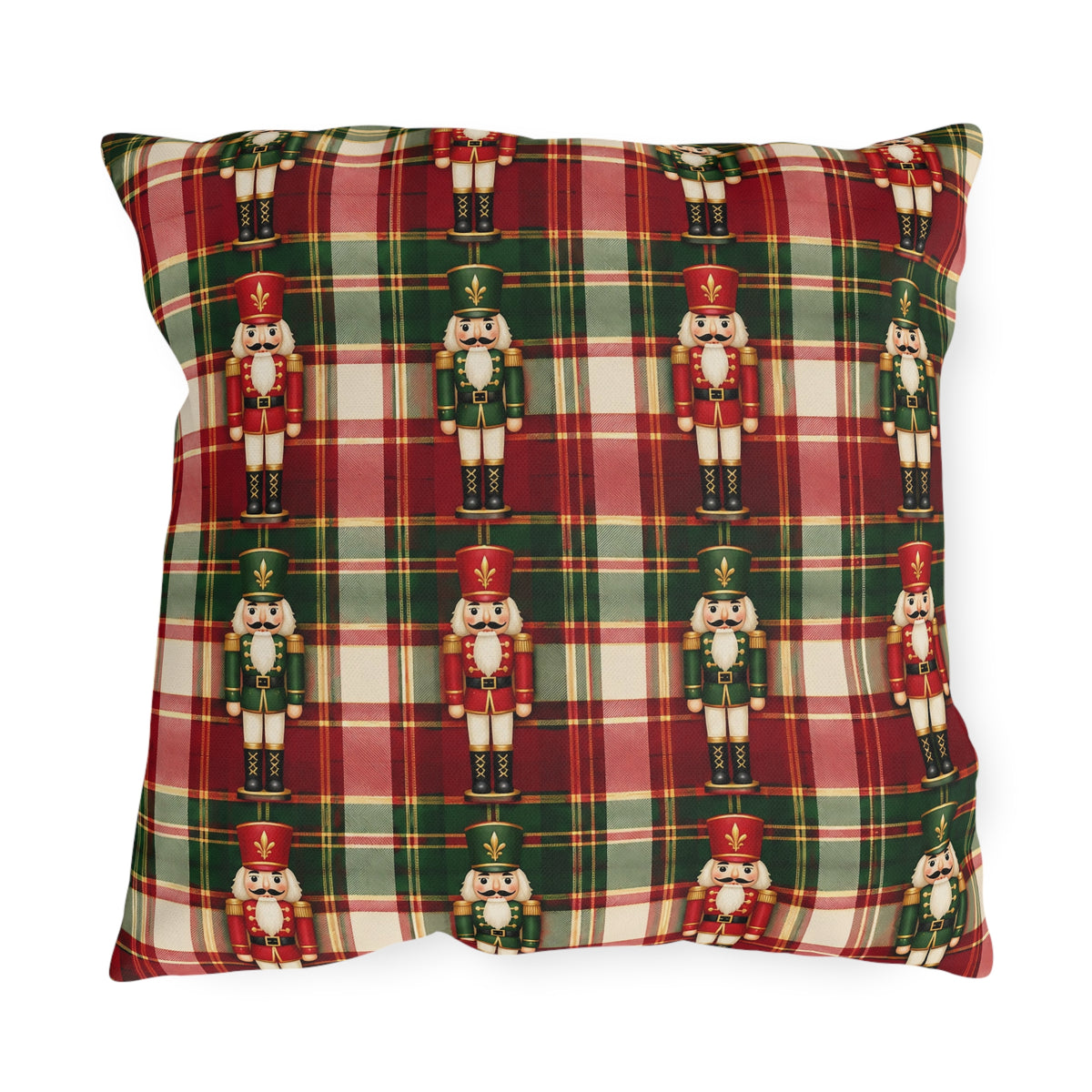 Christmas nutcracker outdoor pillow with small nutcracker soldiers on red, green and cream tartan plaid