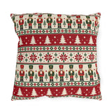 Nordic Christmas nutcracker outdoor pillow with graphic bands of nutcrackers, pine trees and snowflakes in red, green and cream