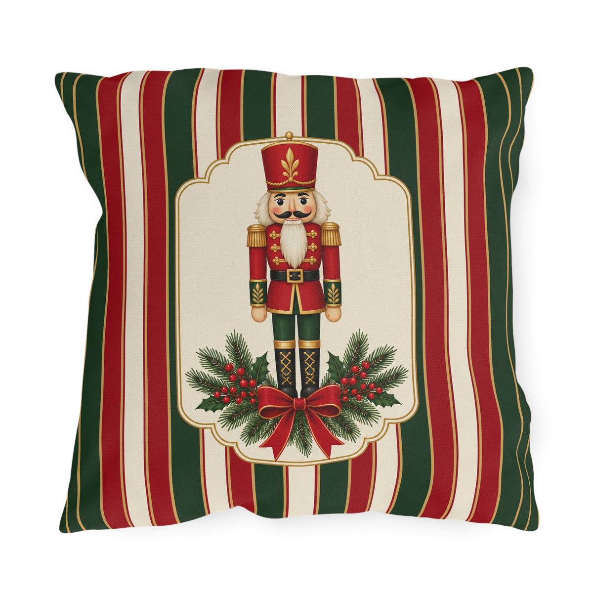 Vintage Christmas nutcracker outdoor pillow with a framed nutcracker soldier, pine and a red bow on red, green and cream stripes
