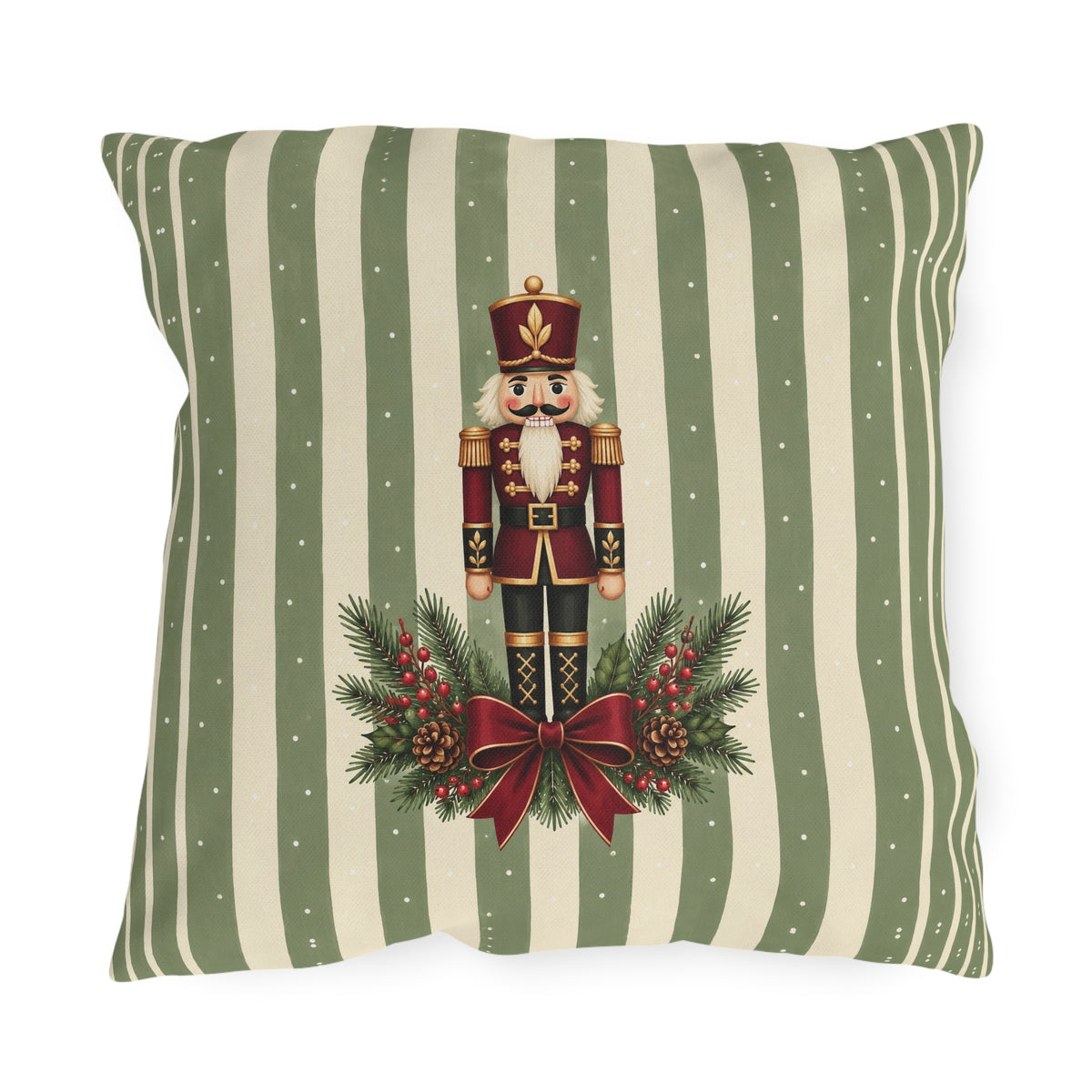 Sage green Christmas nutcracker outdoor pillow with a nutcracker, pine and a burgundy ribbon on sage and cream stripes