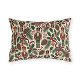 Vintage Christmas nutcracker outdoor lumbar pillow with nutcrackers, pine, pinecones, holly and burgundy ribbon on ivory