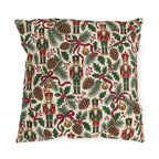 Vintage Christmas nutcracker outdoor pillow with nutcrackers, pine, pinecones, holly and burgundy ribbon on ivory
