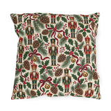 Vintage Christmas nutcracker outdoor pillow with nutcrackers, pine, pinecones, holly and burgundy ribbon on ivory