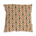 Christmas nutcracker outdoor pillow with a cranberry diamond lattice and green nutcrackers on tan