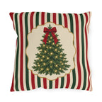 Vintage Christmas tree outdoor pillow with a lit fir tree and red bow in a cream panel on red, green and cream stripes