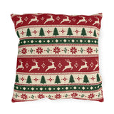 Nordic Christmas reindeer outdoor pillow with graphic bands of reindeer, pine trees and snowflakes in red, green and cream