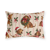 Christmas dachshund outdoor lumbar pillow with dachshunds in Santa hats, scarves and sweaters among holly on cream