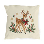 Christmas reindeer outdoor pillow with a spotted reindeer, holly wreath, pine and golden snowflakes on cream