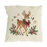 Christmas reindeer outdoor pillow with a spotted reindeer, holly wreath, pine and golden snowflakes on cream