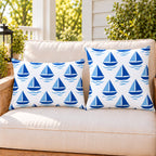 Blue sailboat outdoor pillow and outdoor lumbar pillow styled together as a set on a porch loveseat